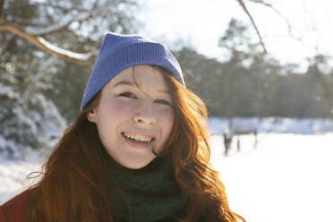 Beautiful woman wearing knit hat on sunny day - FVDF00175