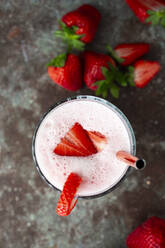 Fresh strawberries and glass of strawberry smoothie - GIOF12721