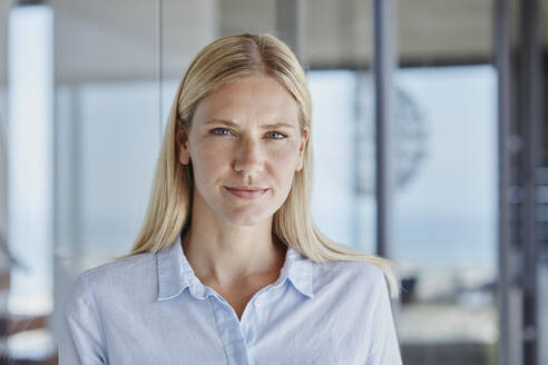 Mid adult woman with blond hair at home - RORF02761