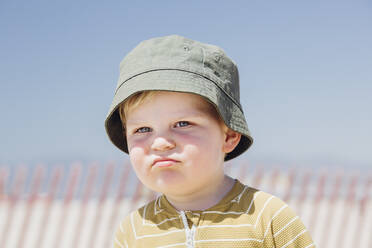 Cute little boy wearing hat at beach during sunny day - ACTF00085