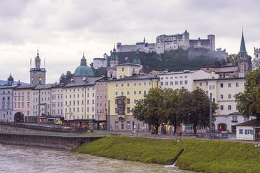 Austria, Salzburg State, Salzburg, Historical old town with Hohensalzburg Fortress in background - TAMF03067