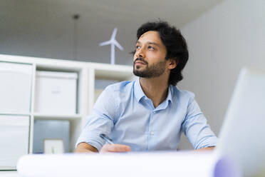 Male entrepreneur contemplating at office - GIOF12821