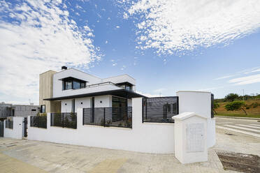 Facade of white new houses - JSMF02261