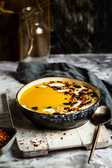 Bowl of ready-to-eat pumpkin soup with coconut milk - SBDF04476