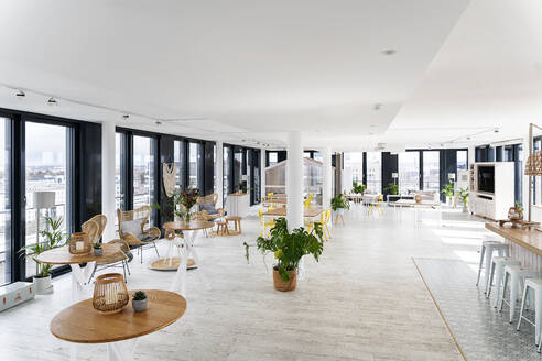 Table and chairs arranged at office cafeteria - PESF02827