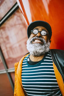 Cheerful bearded senior man clenching teeth - MASF23892
