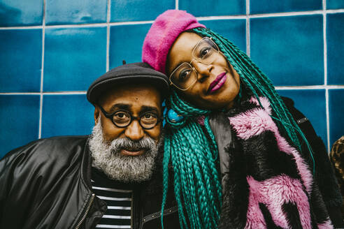 Portrait of senior man and mid adult woman wearing berets - MASF23899