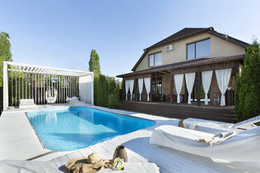 Swimming pool at backyard of house during sunny day - VGF00385