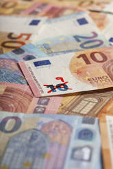 Ten euro banknote with number 9 written on it symbolizing devaluation of currency - MMFF01329