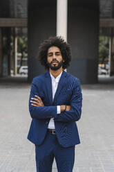 Portrait of fashionable businessman wearing blue suit and grey turtleneck  pullover stock photo