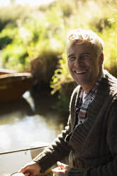 Portrait happy man fishing - CAIF30689