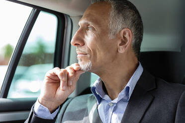 Thoughtful businessman sitting in car - EIF01374
