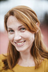 Smiling redhead woman with freckles - LJF02209