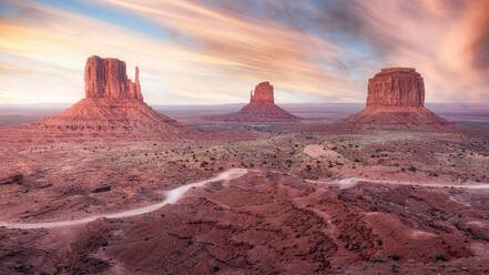 Spectacular scenery of tall rocky formations located in Monument Valley in America under colorful sky at sunset - ADSF24923