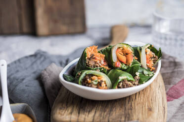 Steamed spring rolls with chopped vegetable and meat filling in tray - SBDF04496