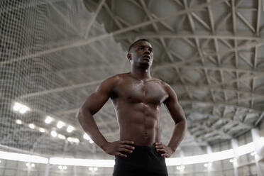 African American runner resting during workout - CAVF94290