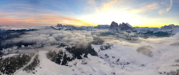 Aerial view of the snowcapped Sassolungo and Sassopiatto mountains at dawn, Seiser Alm, Dolomites, South Tyrol, Italy, Europe - RHPLF19800