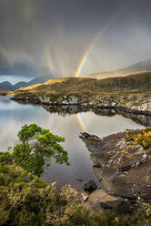 Rainbow and rain clouds over Upper Lake, Killarney National Park, County Kerry, Munster, Republic of Ireland, Europe - RHPLF19816