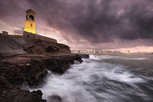 Sur lighthouse with the stormy sea on the cliff and a pink sunset, Sur, Oman, Middle East - RHPLF19932