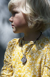 Cute blond girl wearing yellow floral shirt - GISF00812