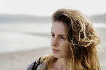 Contemplating young woman at beach - AFVF09021