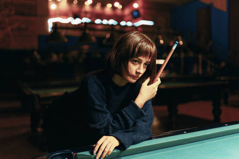 Young Girl Playing Pool In A Bar - CAVF94309