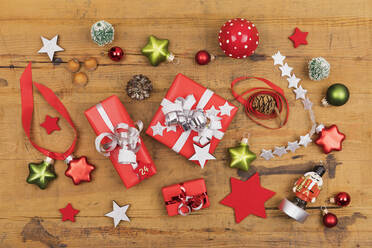 Collection of Christmas themed items flat laid on wooden surface - GWF07047