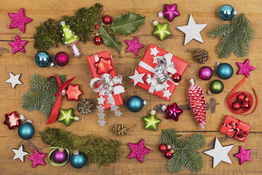 Collection of Christmas themed items flat laid on wooden surface - GWF07049