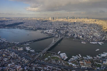 Turkey, Istanbul, Aerial view of Ataturk and Golden Horn Metro bridges at dusk - TAMF03126