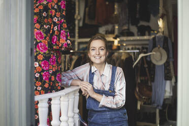Portrait of smiling female employee at clothing store - MASF25019