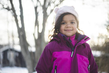 Portrait of smiling girl wearing warm clothing during winter - MASF25110