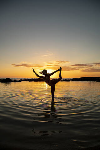 Yoga pose silhouette on beach during sunset (cave view) - ballet, dance,  gymnastics - ballerina, dancer, gymnast