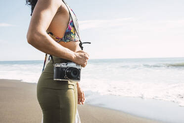 Close up of a photographer with her camera. Photographer concept. - CAVF94444