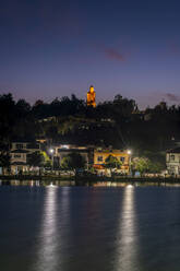 Buddha statue above Nong Tung Lake at night, Kengtung, Myanmar - CAVF94606