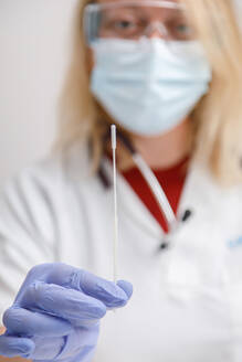 Female doctor preparing to do a pcr test - ADSF25473