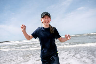 USA, California, Ventura, Smiling girl on beach - ISF24817