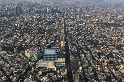 Mexico, Mexico City, Aerial view of densely populated city at dusk - RUNF04599