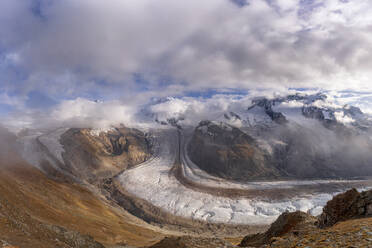 Cloudy sky over snowcapped mountains and Gorner Glacier (Gornergletscher), Zermatt, canton of Valais, Switzerland, Europe - RHPLF20003