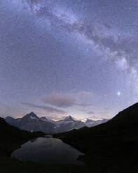 Milky Way over Bachalpsee lake on a summer night, Grindelwald, Jungfrau Region, Bernese Oberland, Canton of Bern, Switzerland, Europe - RHPLF20104