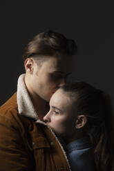 Studio portrait affectionate young couple - FSIF05730