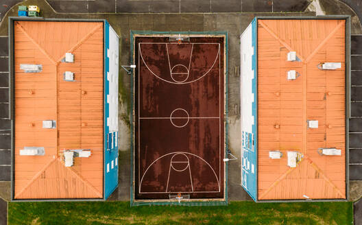 Aerial view basketbal court in-between flats near Ponta Delgada at Sao Miguel Island, Azores, Portugal. - AAEF09273