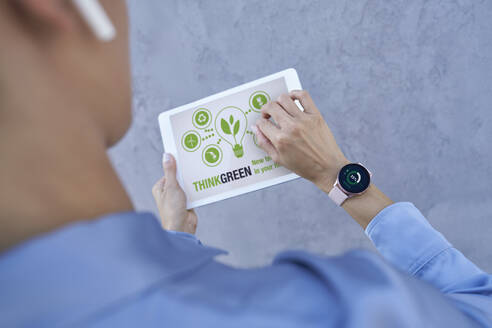 Businesswoman with smart watch using digital tablet - ABIF01417