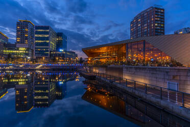 View of MediaCity UK and restaurant at dusk, Salford Quays, Manchester, England, United Kingdom, Europe - RHPLF20397
