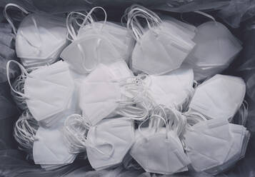 Abundance of white disposable protective face masks - FSIF05839