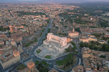 Aerial view of Altare della Patria with Colosseum in Rome, Italy. - AAEF09584