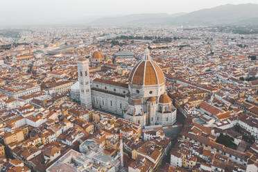 Aerial view of Florence's cathedral Santa Maria del Fiore during sunrise, Italy. - AAEF09625