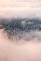 Aerial View Of Buildings In Rio De Janeiro City Through Gap In Low Clouds At Sunrise - AAEF09661