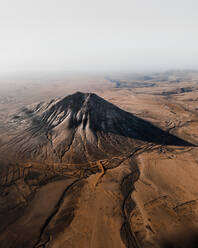 Aerial view of Montana Tindaya, a peak mountain in Timanfaya national park, Fuerteventura, Canary Islands, Spain. - AAEF09804