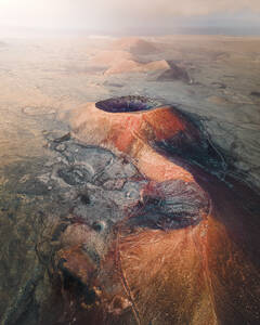 Aerial view of Calderon Hondo, a volcano in a vast desert valley near La Oliva on Canary Islands, Spain. - AAEF09832