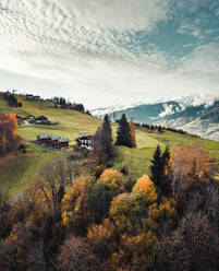 Aerial view of little houses and snowy peaks of Kaprun, Alps, Austria. - AAEF09891
